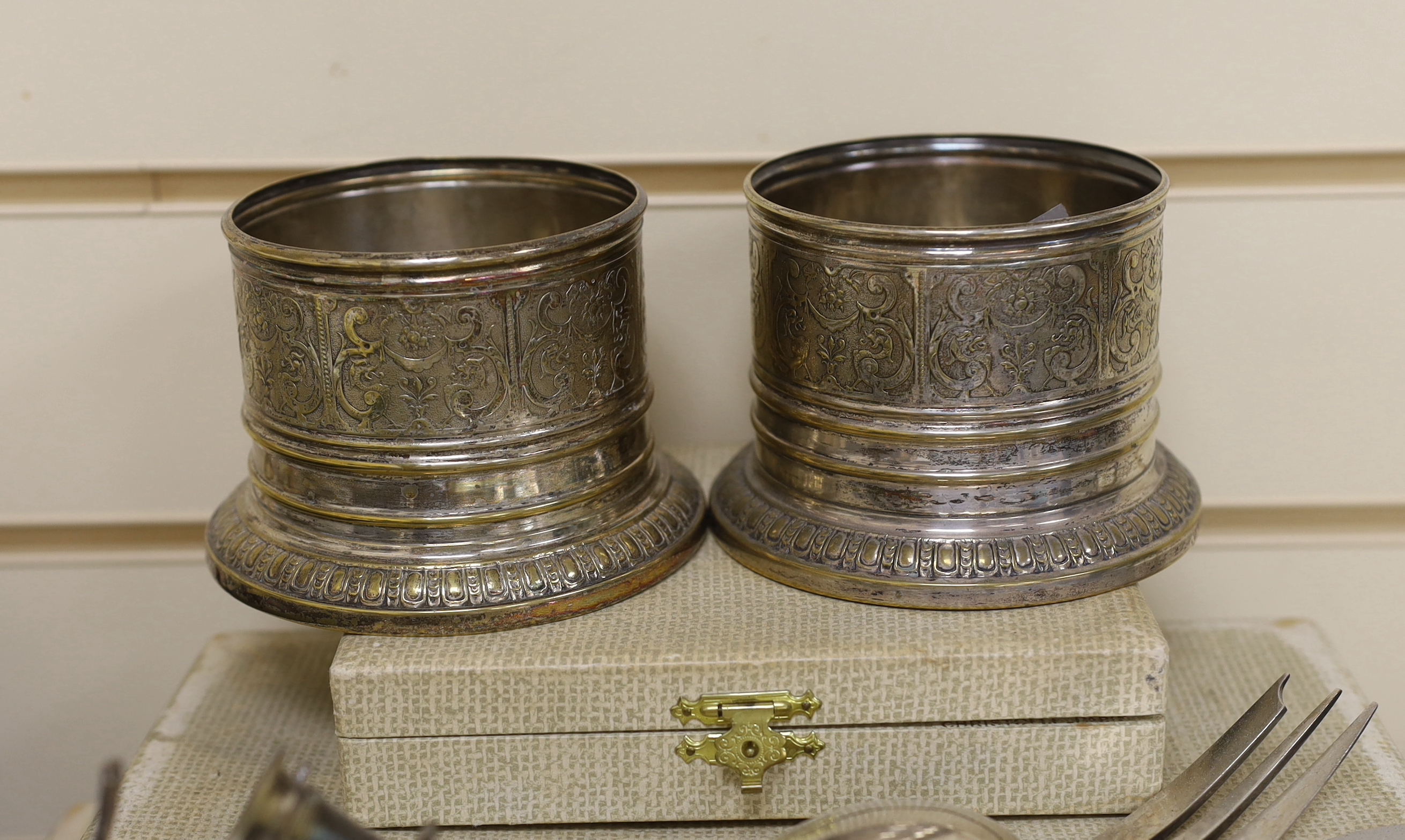 A pair of WMF coasters and two Christofle canteens of cutlery etc